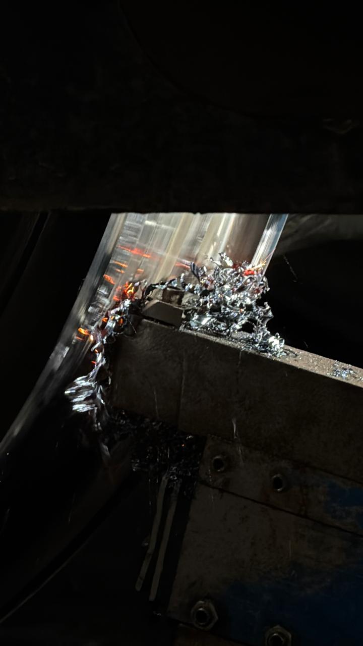 Close view of wheel tyre cutting and metal shavings